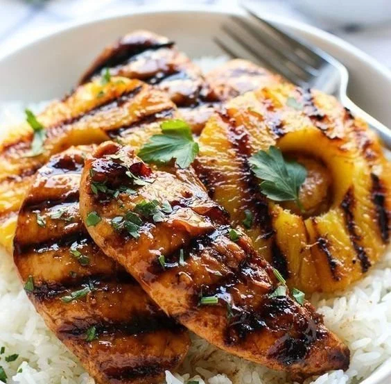 Plate of Hawaiian Chicken served with Pineapple and Coconut Rice