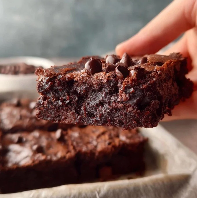 Delicious healthy fudgy brownies on a light background