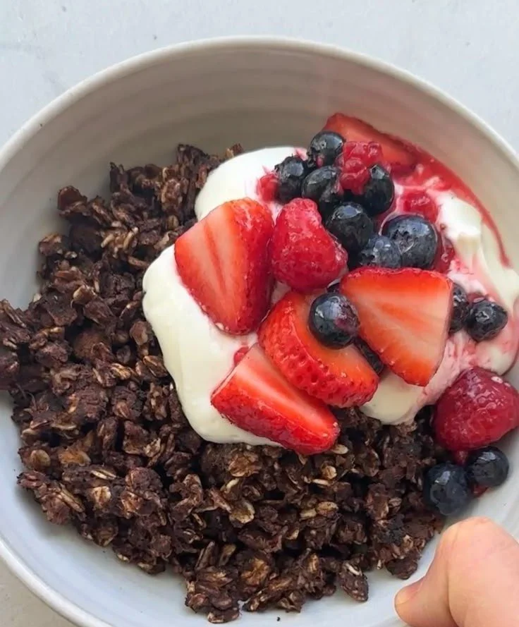 Chocolate Scrambled Oats 2 Bowl of Chocolate Scrambled Oats topped with fruits and nuts