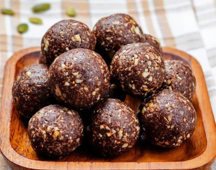 Homemade chocolate energy balls made with dates and cocoa for a nutritious snack.