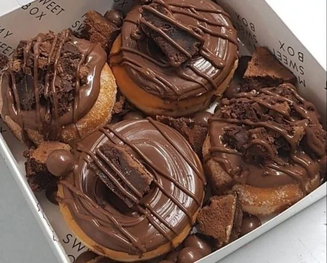 A selection of beautifully crafted gourmet desserts on a decorative plate