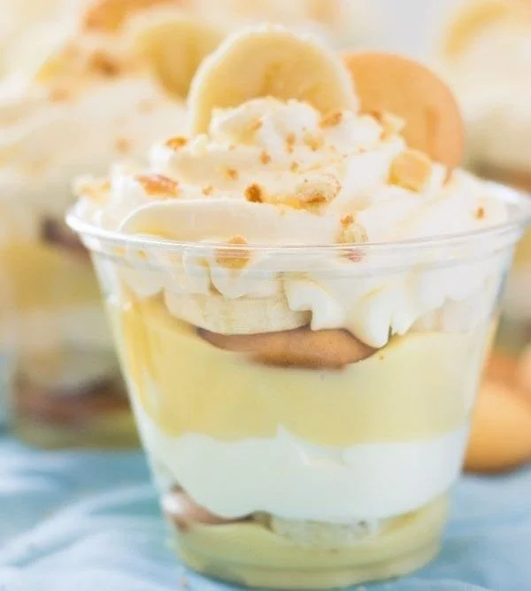 Delicious homemade banana pudding cups garnished with fresh banana slices
