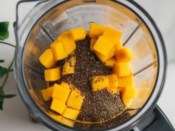 Mango Chia Seed Smoothie with fresh mango and chia seeds in a glass