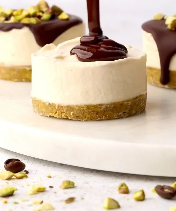 Mini Pistachio and Coffee Cheesecakes 4 Mini pistachio and coffee cheesecakes topped with crushed pistachios.