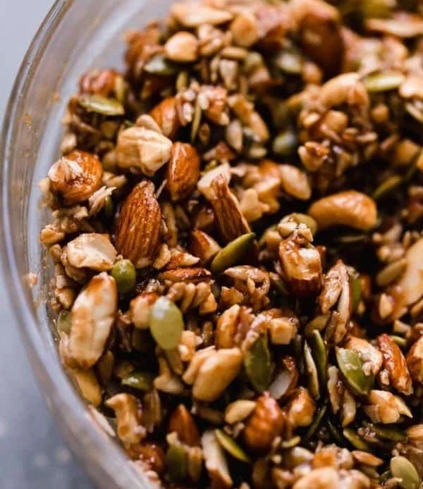 Bowl of Paleo granola with honey and cinnamon ingredients