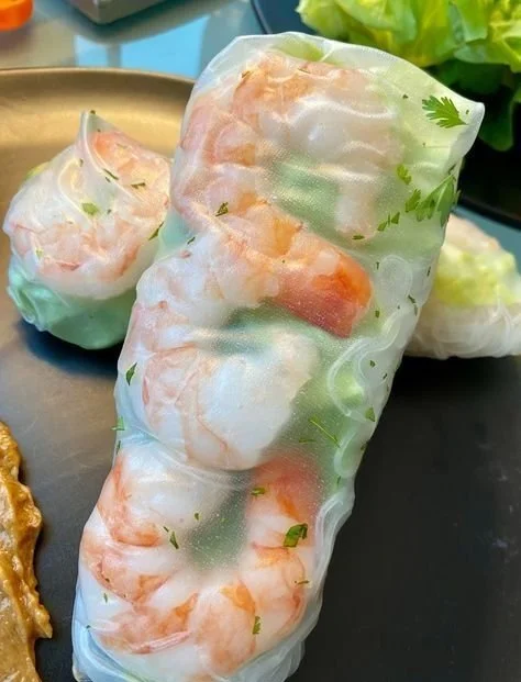 Shrimp and Avocado Spring Rolls 4 Delicious shrimp avocado spring rolls served with dipping sauce.