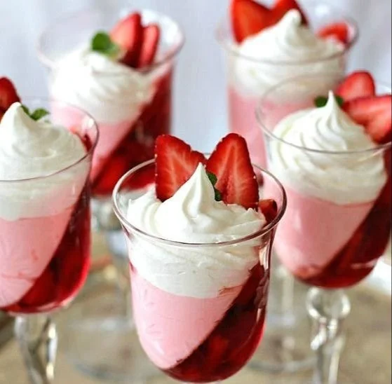 Delicious strawberry jello parfait layered with fresh strawberries and whipped cream