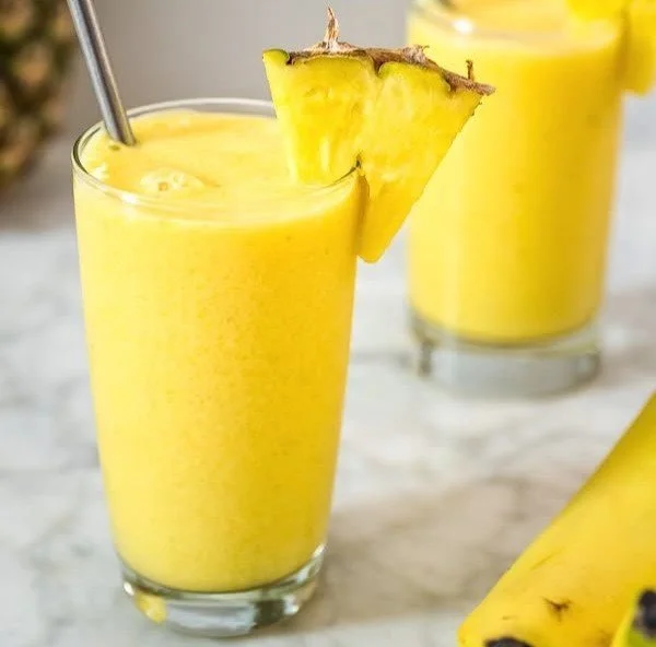 Delicious tropical smoothie with fresh fruits in a vibrant glass
