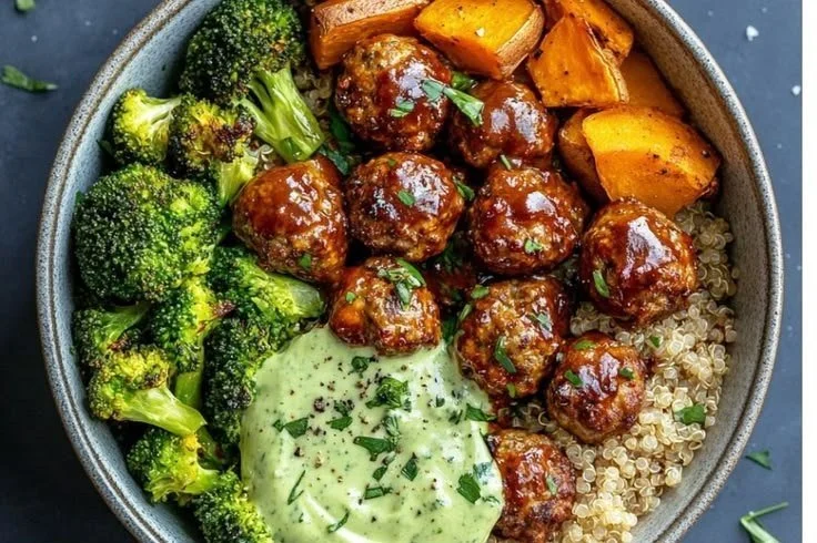 Delicious barbecue meatball bowls topped with avocado goddess sauce.