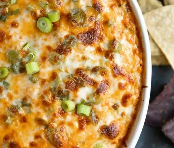 Buffalo Chicken Dip 4 Delicious Buffalo Chicken Dip served in a bowl with crackers on the side