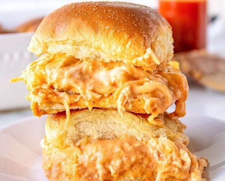 Buffalo Chicken Sliders served in a platter with fresh garnishes