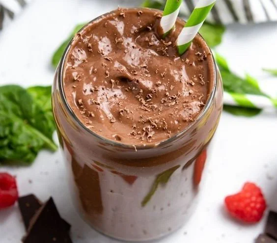 Creamy chocolate raspberry smoothie with avocado in a glass