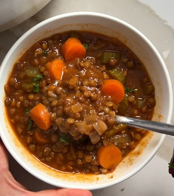Classic Lentil Soup 4 Bowl of classic lentil soup garnished with fresh herbs.