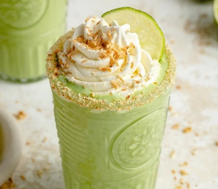 Creamy Coconut Key Lime Pie Smoothie 4 Creamy coconut key lime pie smoothie in a glass with lime and coconut garnish