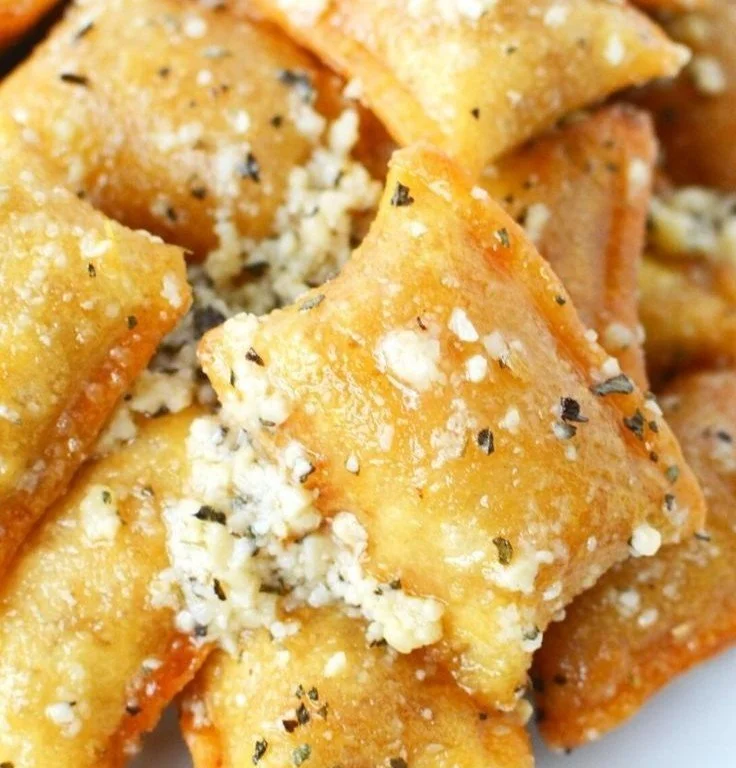 Homemade Garlic Parmesan Pizza Rolls served on a wooden board