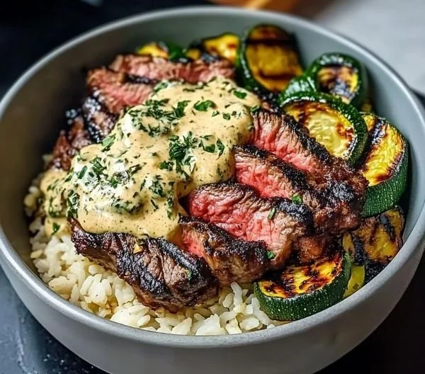 Grilled Steak Bowl with Sauce & Grilled Zucchini Bliss 4 Delicious grilled steak bowl topped with sauce and grilled zucchini