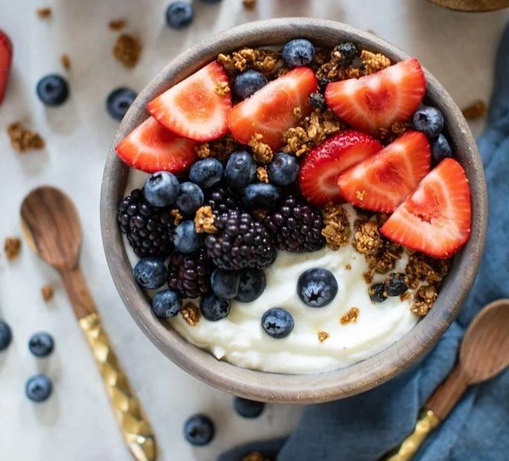 Healthy Greek Yogurt Breakfast Bowl 4 Healthy Greek yogurt breakfast bowl topped with fresh fruits and nuts