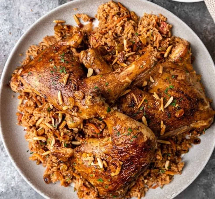 Delicious plate of Kabsa, a traditional Middle Eastern rice dish with spices and meat.