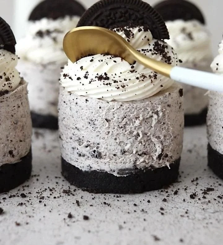 Delicious no-bake Oreo cheesecakes topped with crushed Oreos.