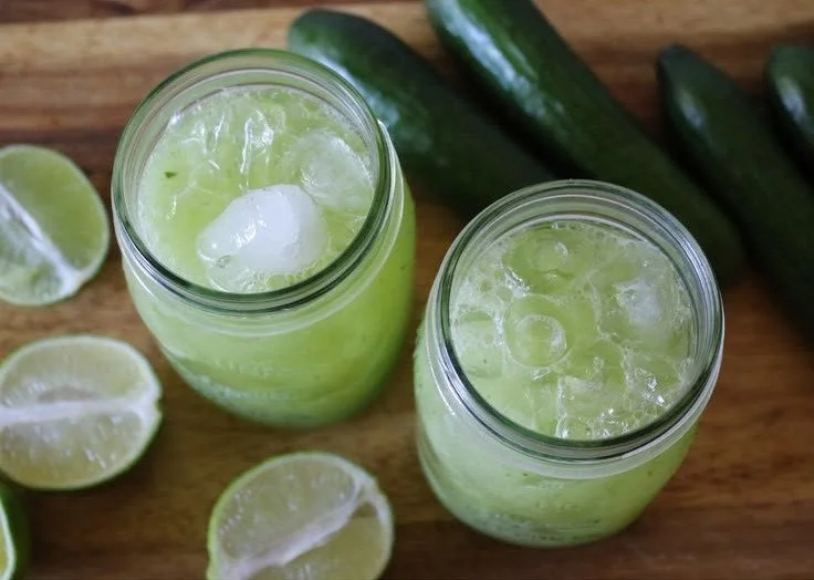 Refreshing cucumber lime fresh water in a glass with mint leaves