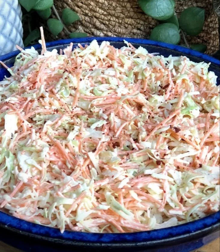 Simple Coleslaw 4 Fresh bowl of simple coleslaw with shredded cabbage and carrots