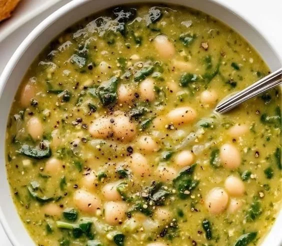 Spinach and White Bean Soup 4 Bowl of nutritious Spinach and White Bean Soup garnished with fresh herbs
